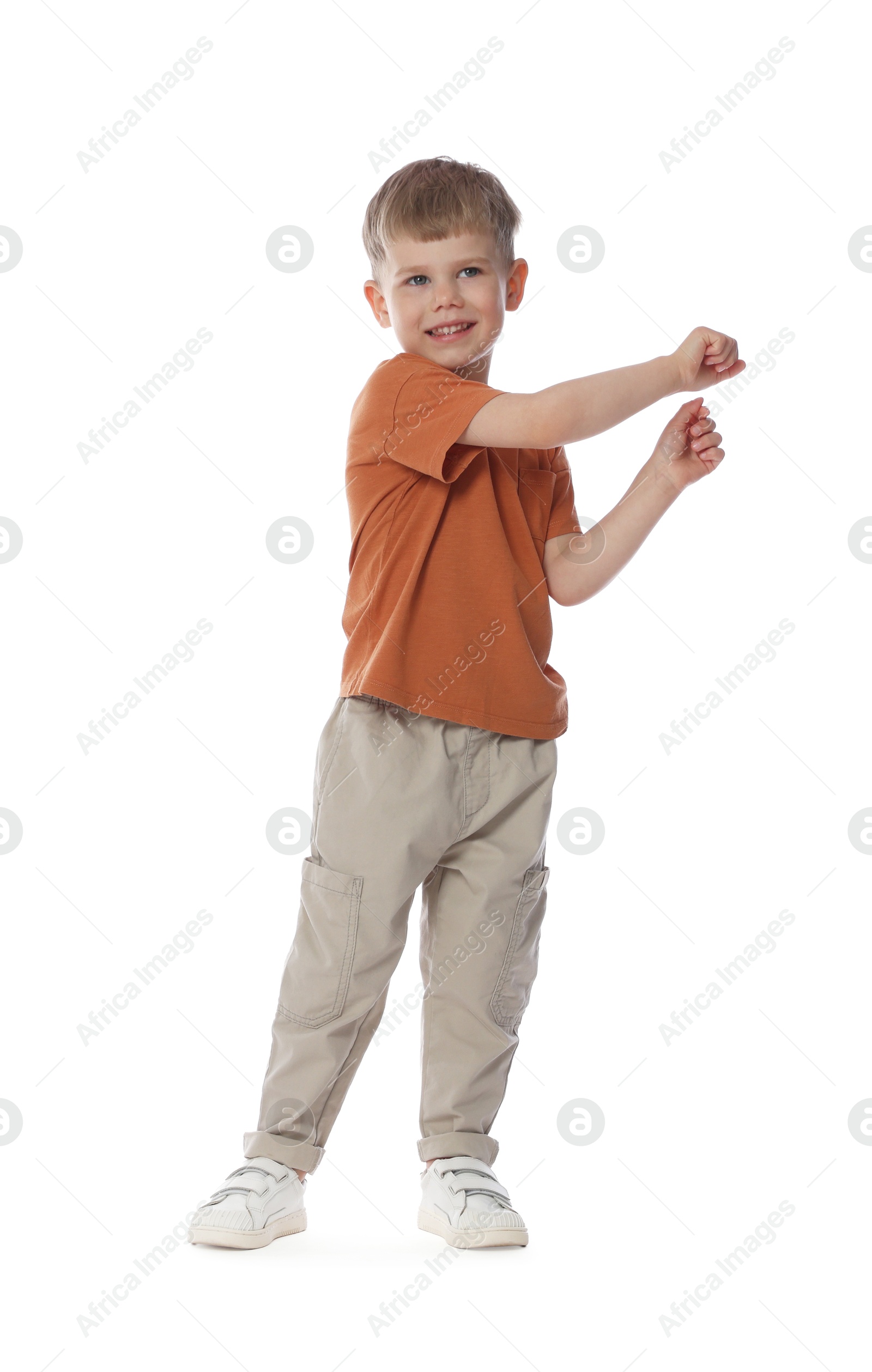 Happy little boy dancing on white background Photo of Happy little boy dancing on white background