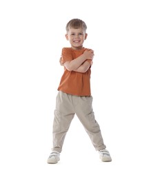 Photo of Happy little boy dancing on white background
