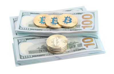Photo of Cryptocurrency. Bitcoins and dollar banknotes isolated on white