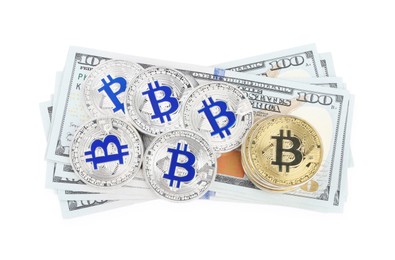Photo of Cryptocurrency. Bitcoins and dollar banknotes isolated on white, top view