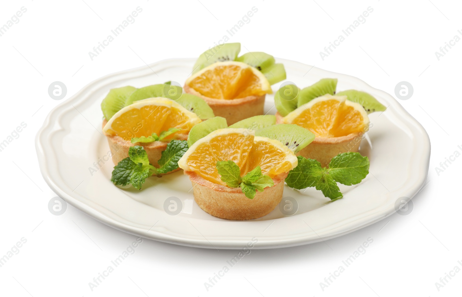 Tartlets with fruits and mint isolated on white. Delicious dessert Photo of Tartlets with fruits and mint isolated on white. Delicious dessert