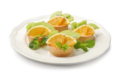 Photo of Tartlets with fruits and mint isolated on white. Delicious dessert