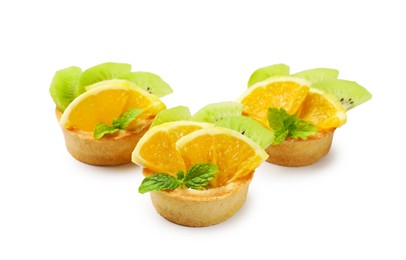 Photo of Tartlets with fruits and mint isolated on white. Delicious dessert