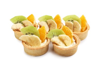 Photo of Tartlets with fruits isolated on white. Delicious dessert