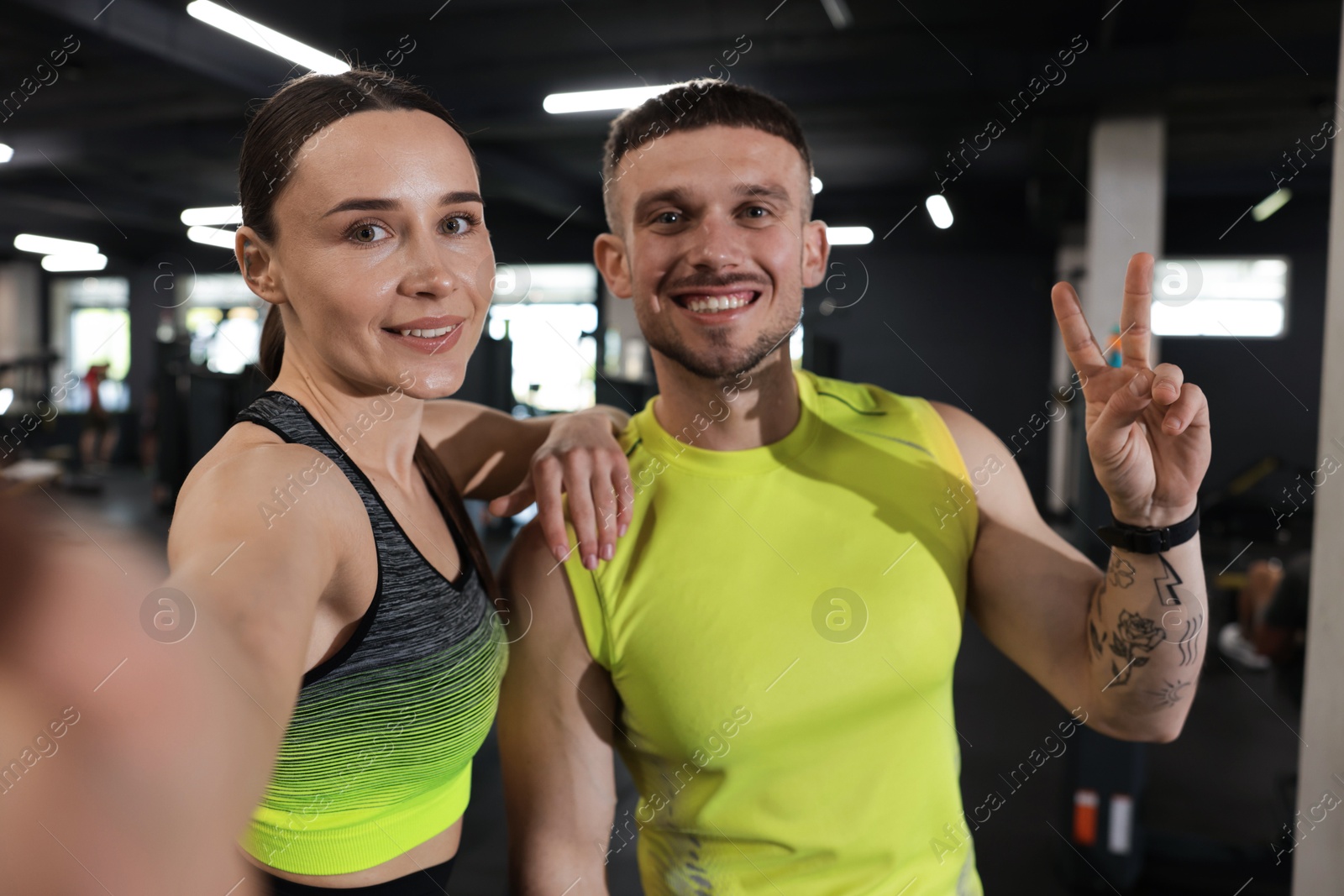 Happy personal trainers taking selfie in gym Photo of Happy personal trainers taking selfie in gym