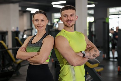 Photo of Portrait of professional personal trainers in gym
