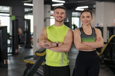 Photo of Portrait of professional personal trainers in gym