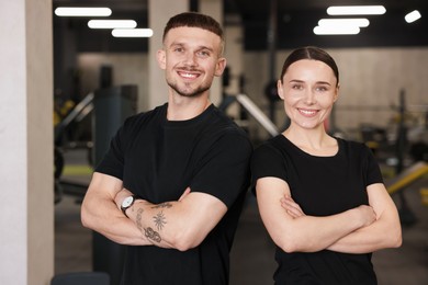 Photo of Portrait of professional personal trainers in sport center