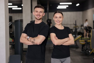 Photo of Portrait of professional personal trainers in sport center