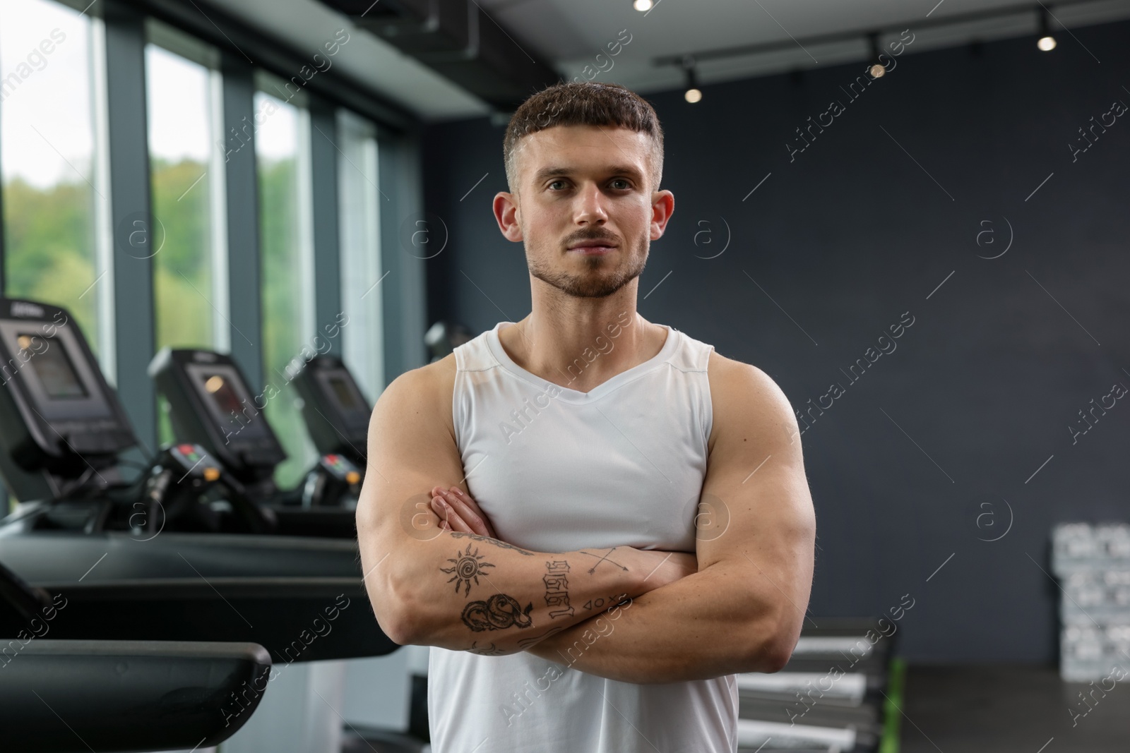 Portrait of professional personal trainer in sport center Photo of Portrait of professional personal trainer in sport center