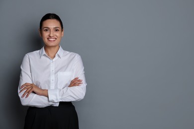 Photo of Portrait of confident business woman on grey background. Space for text