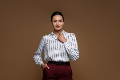 Photo of Portrait of confident business woman on brown background
