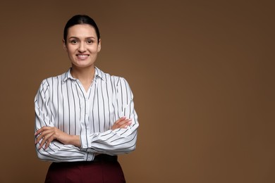 Photo of Portrait of confident business woman on brown background. Space for text