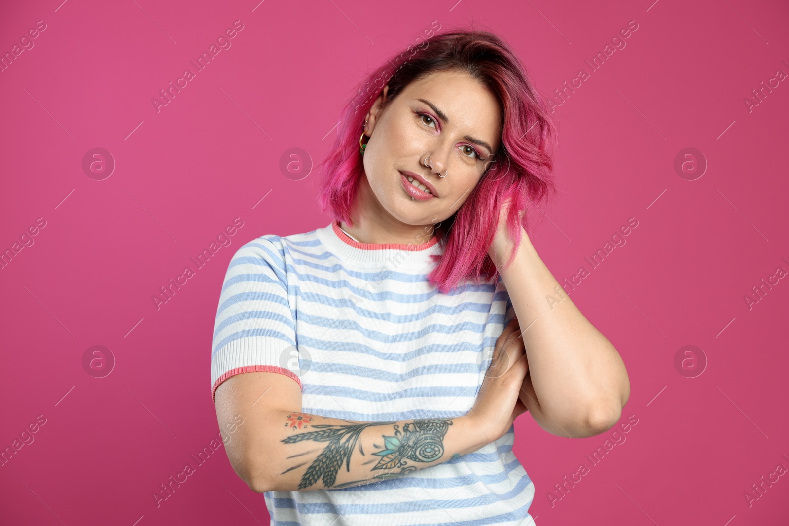 Beautiful woman with bright dyed hair on pink background Photo of Beautiful woman with bright dyed hair on pink background
