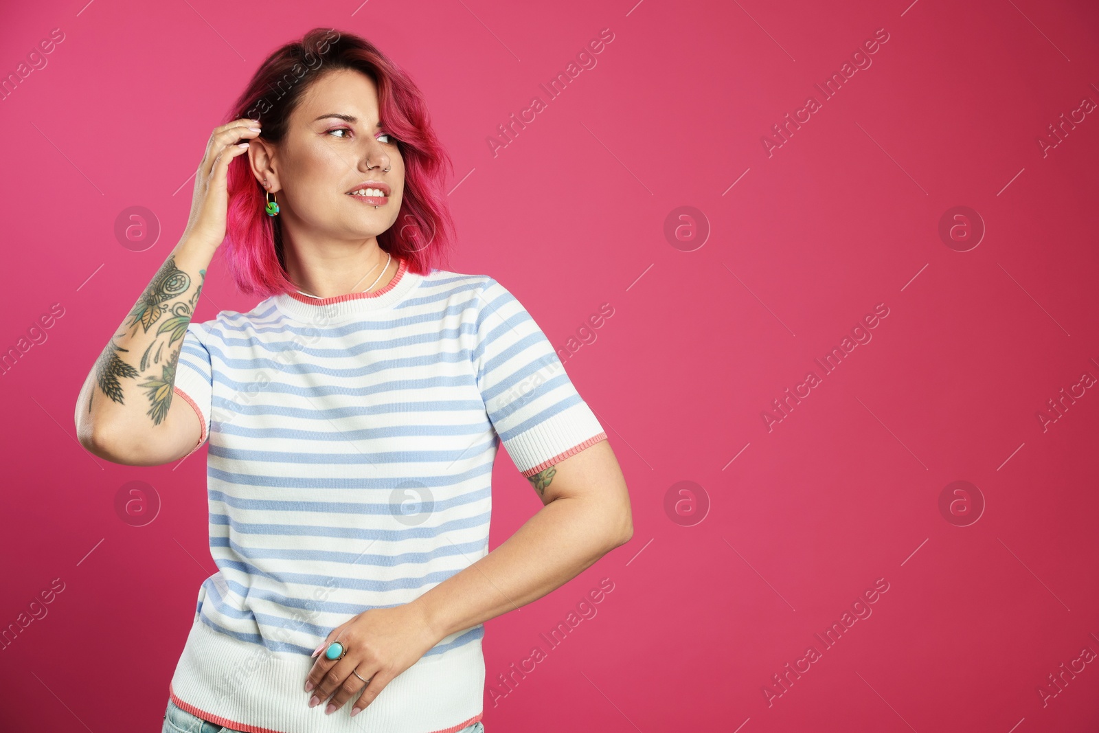 Beautiful woman with bright dyed hair on pink background, space for text Photo of Beautiful woman with bright dyed hair on pink background, space for text