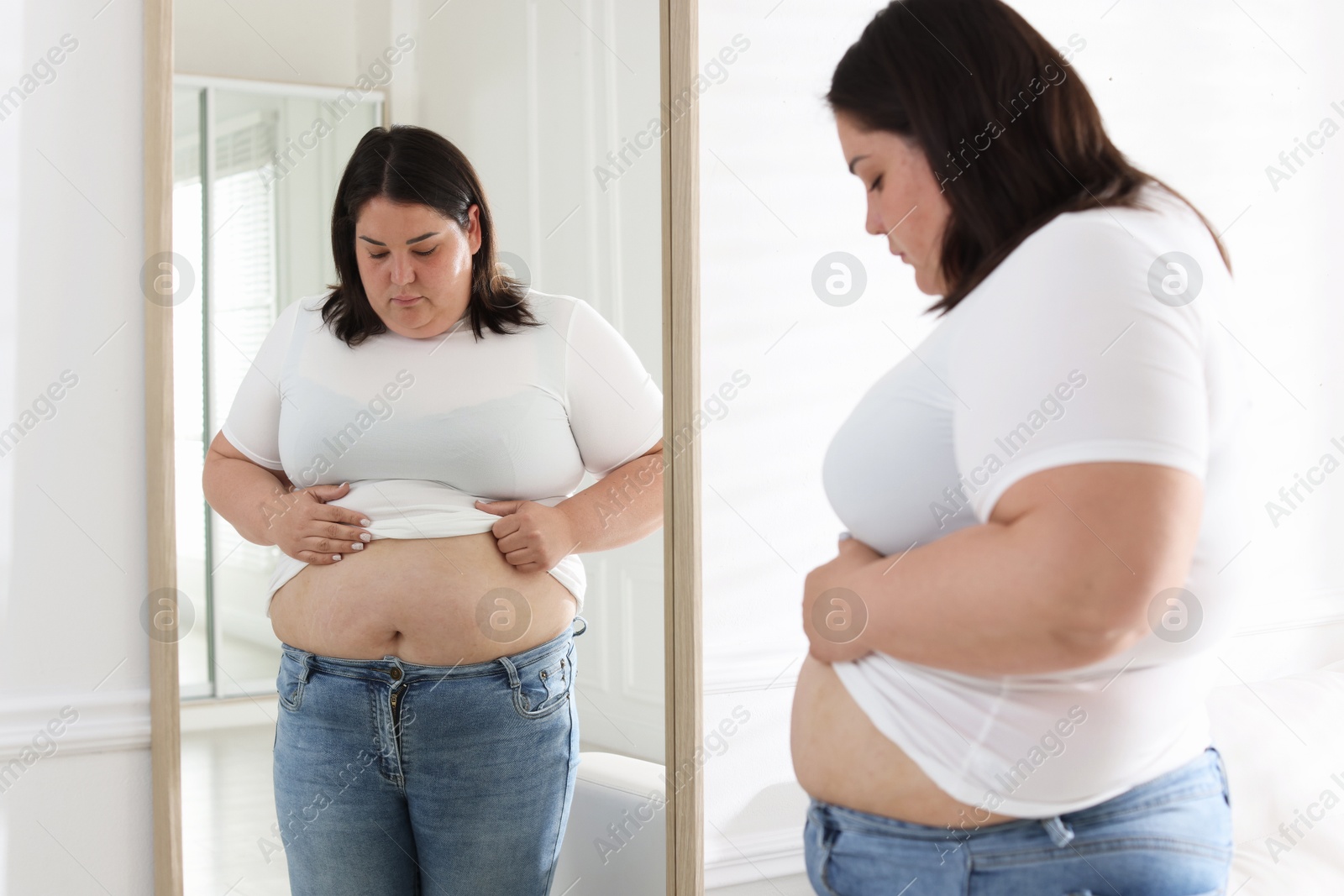 Photo of Woman with excessive belly fat near mirror indoors. Overweight problem