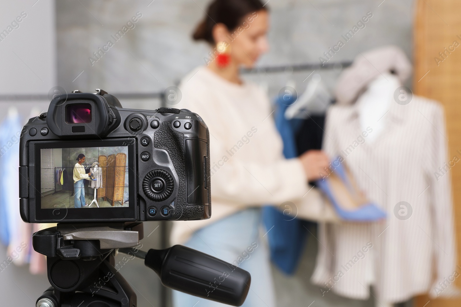 Professional stylist filming video on camera indoors, selective focus Photo of Professional stylist filming video on camera indoors, selective focus
