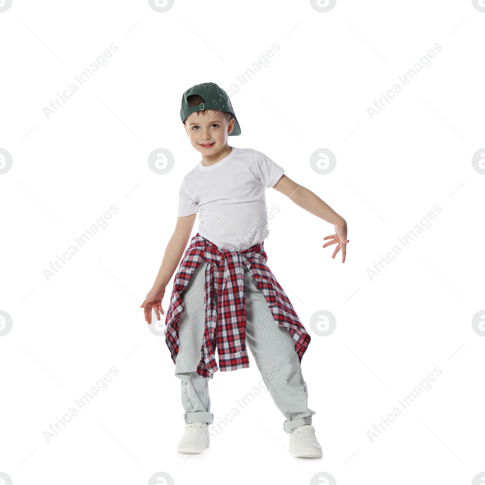 Happy little boy in baseball hat dancing on white background Photo of Happy little boy in baseball hat dancing on white background