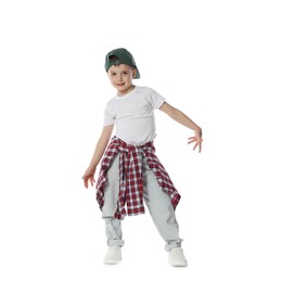 Photo of Happy little boy in baseball hat dancing on white background