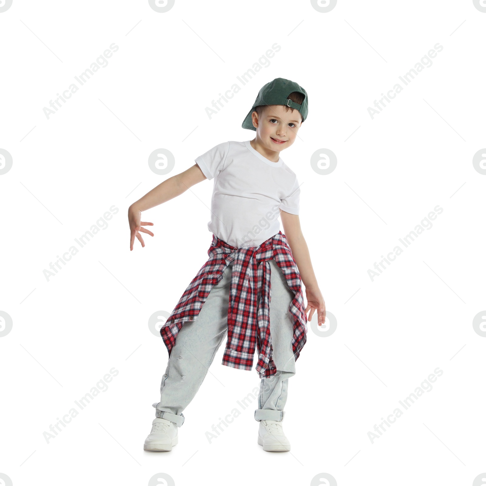 Happy little boy in baseball hat dancing on white background Photo of Happy little boy in baseball hat dancing on white background