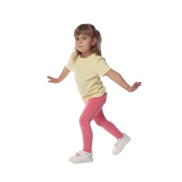 Photo of Cute little girl dancing on white background