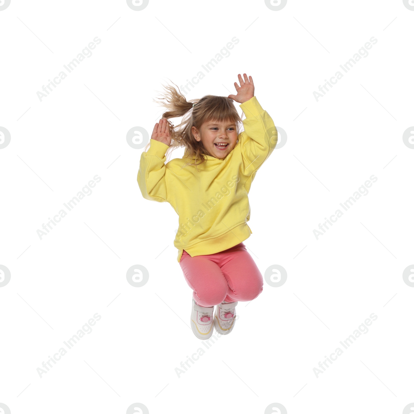 Happy little girl dancing on white background Photo of Happy little girl dancing on white background