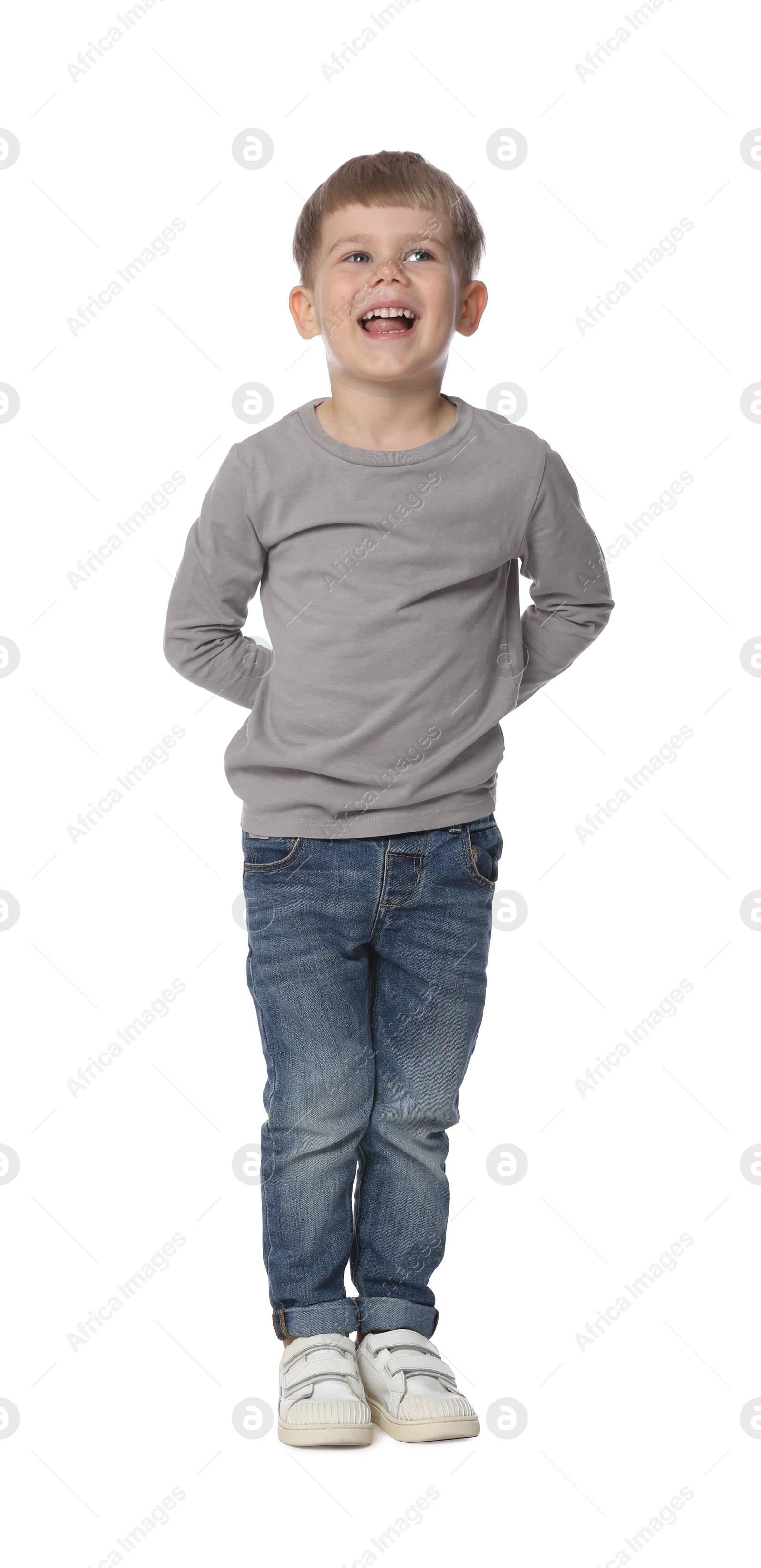 Happy little boy dancing on white background Photo of Happy little boy dancing on white background
