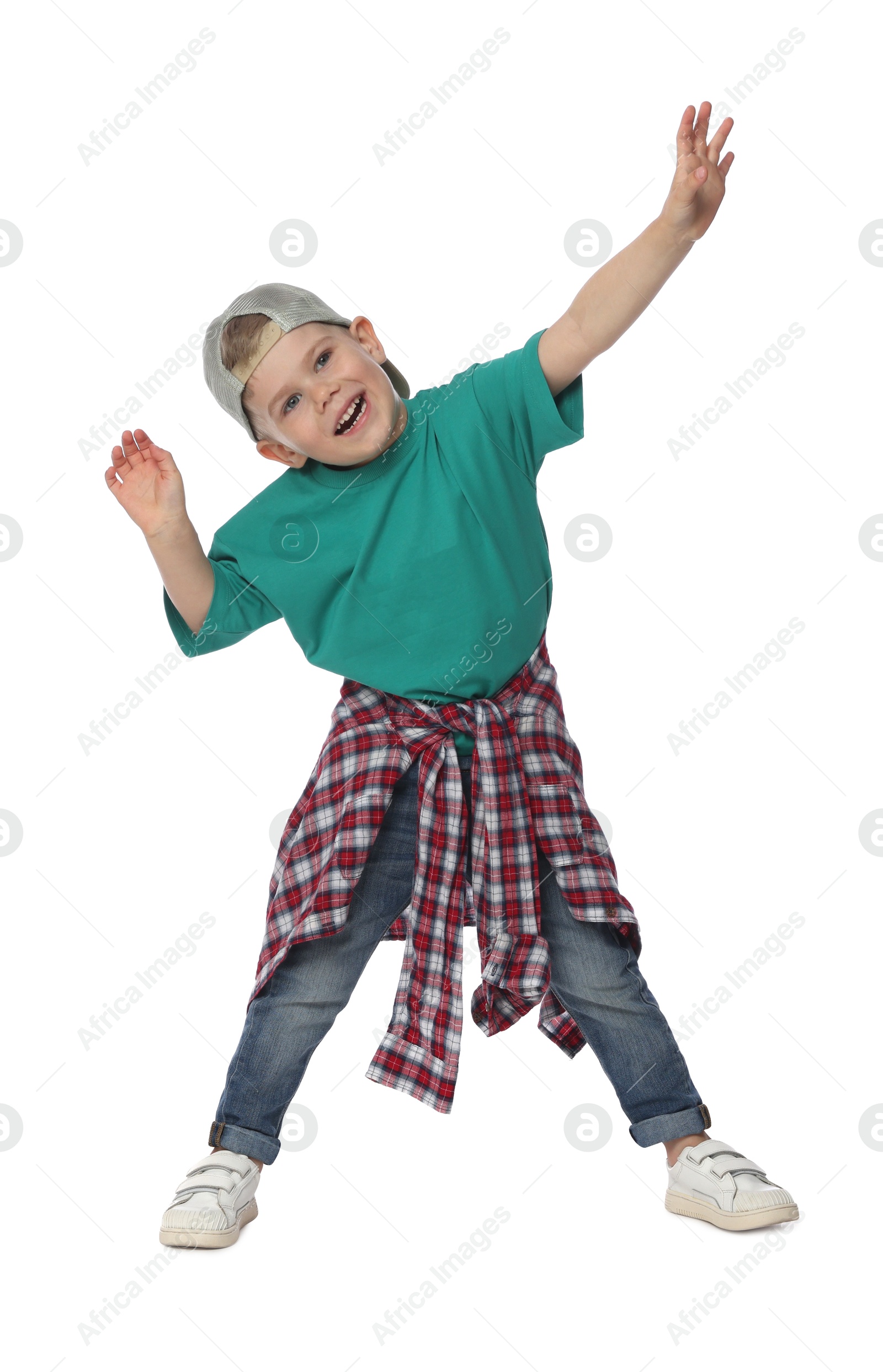 Happy little boy dancing on white background Photo of Happy little boy dancing on white background