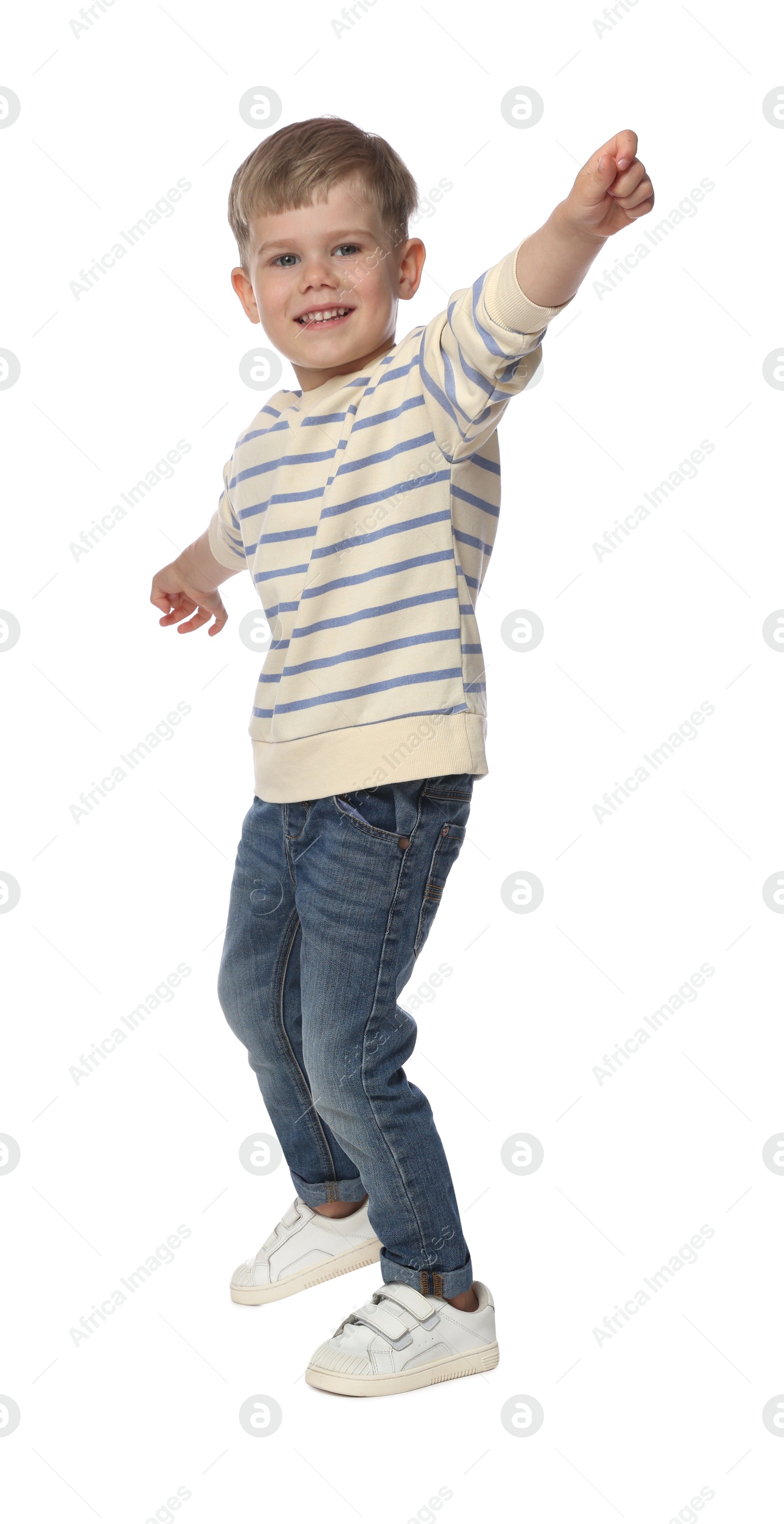 Happy little boy dancing on white background Photo of Happy little boy dancing on white background