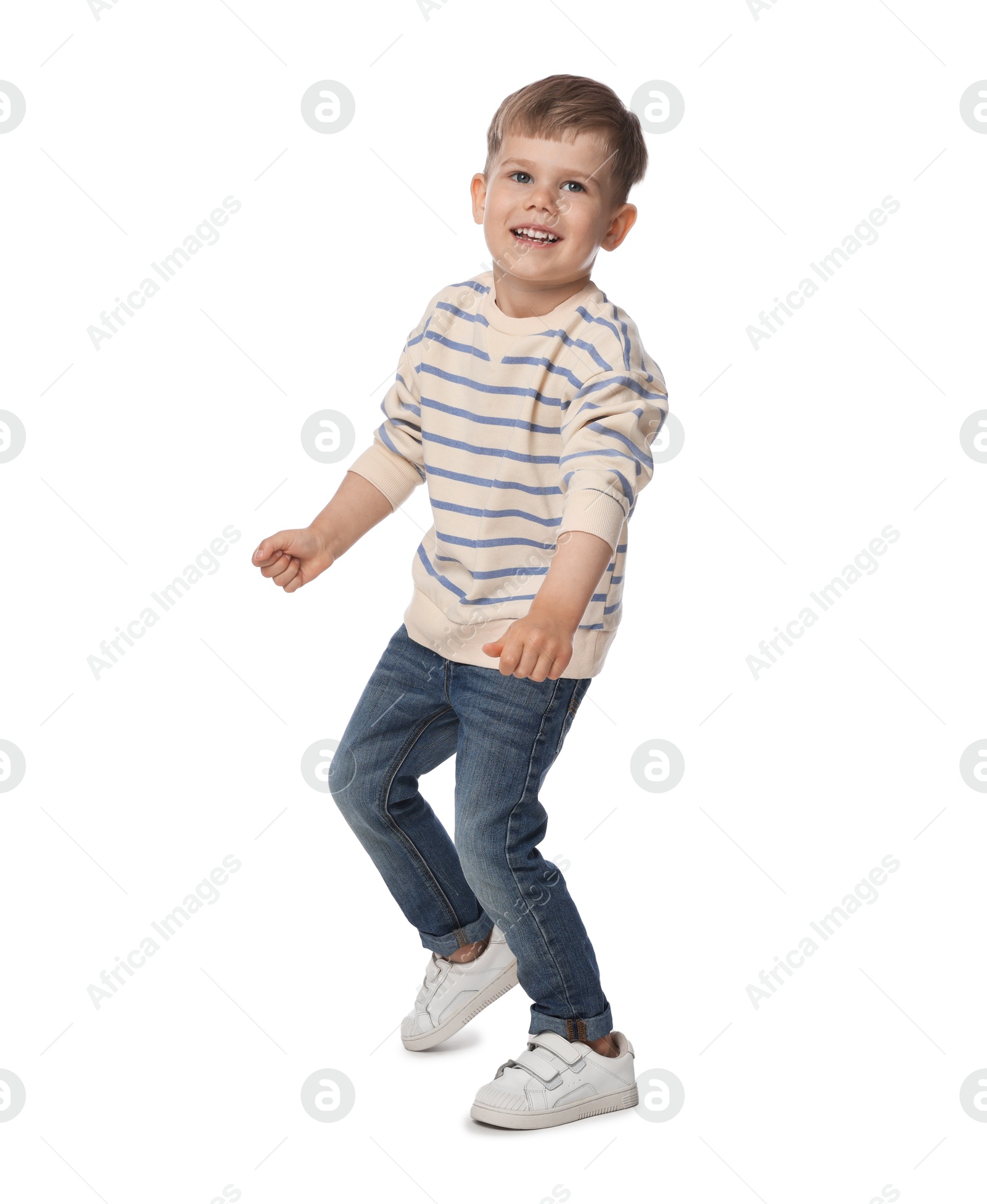 Happy little boy dancing on white background Photo of Happy little boy dancing on white background