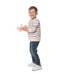 Photo of Happy little boy dancing on white background
