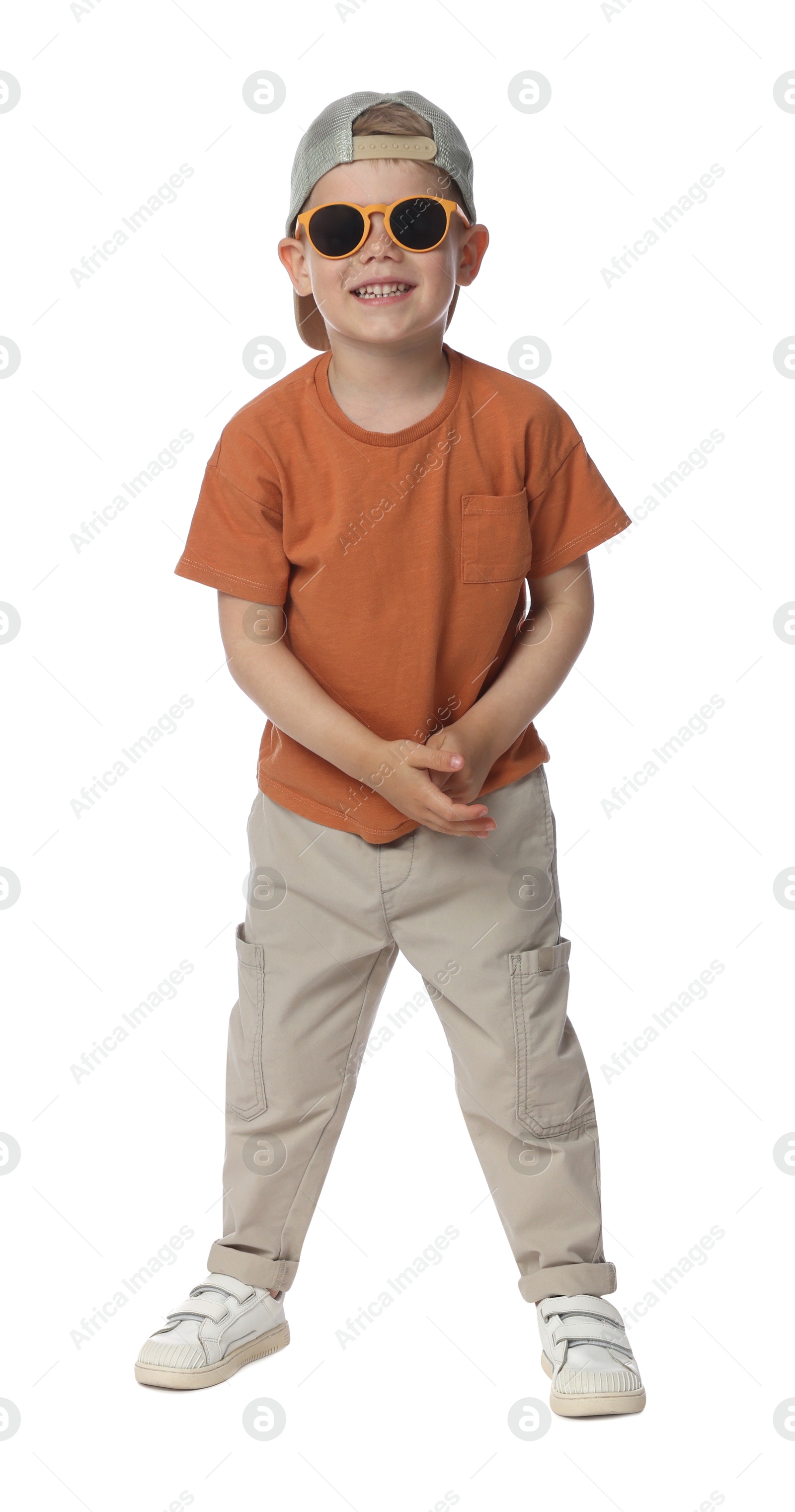 Happy little boy with sunglasses dancing on white background Photo of Happy little boy with sunglasses dancing on white background