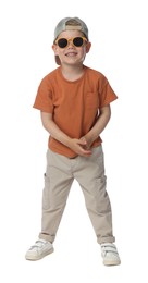 Photo of Happy little boy with sunglasses dancing on white background