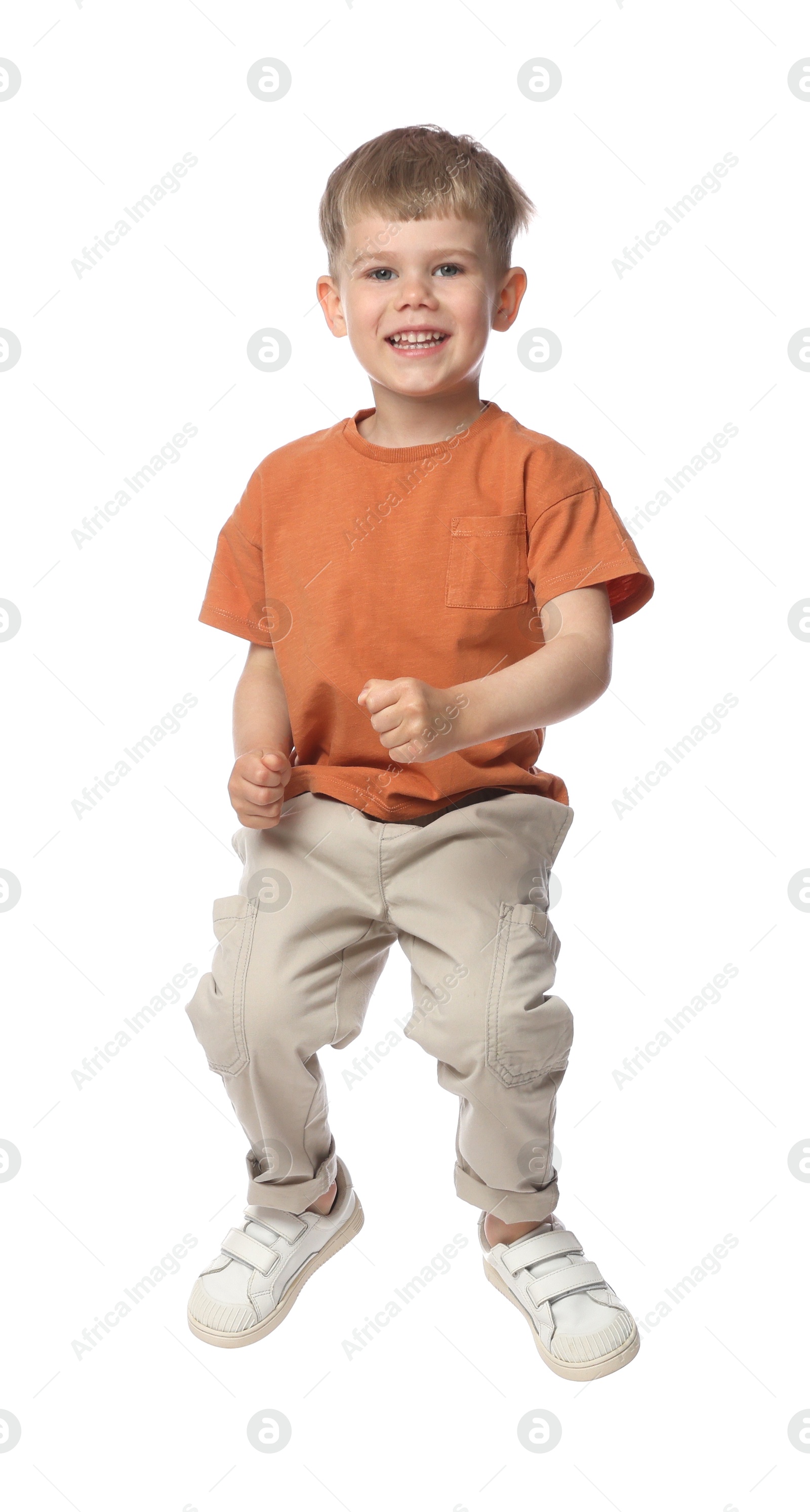 Happy little boy dancing on white background Photo of Happy little boy dancing on white background