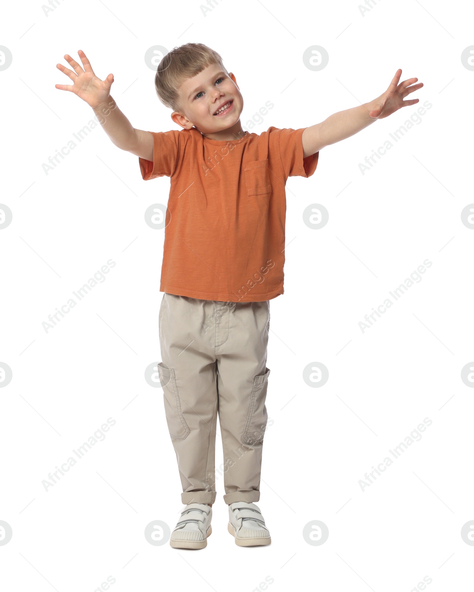 Happy little boy dancing on white background Photo of Happy little boy dancing on white background