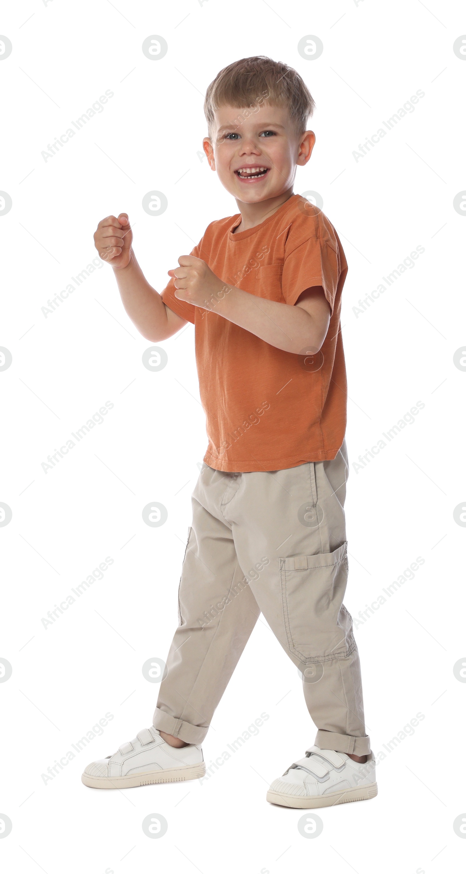 Happy little boy dancing on white background Photo of Happy little boy dancing on white background