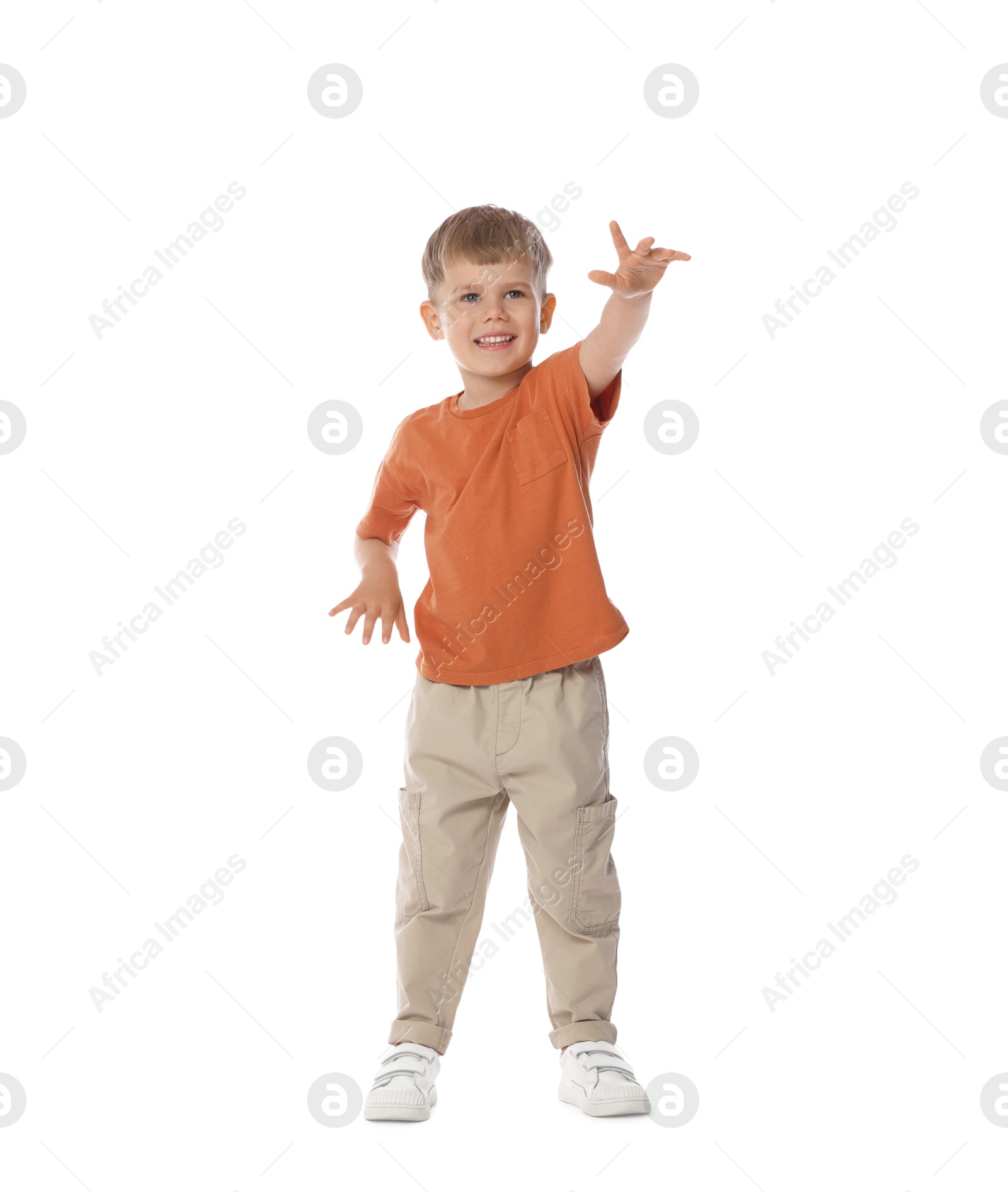 Happy little boy dancing on white background Photo of Happy little boy dancing on white background