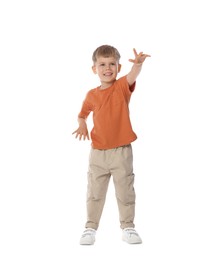 Photo of Happy little boy dancing on white background