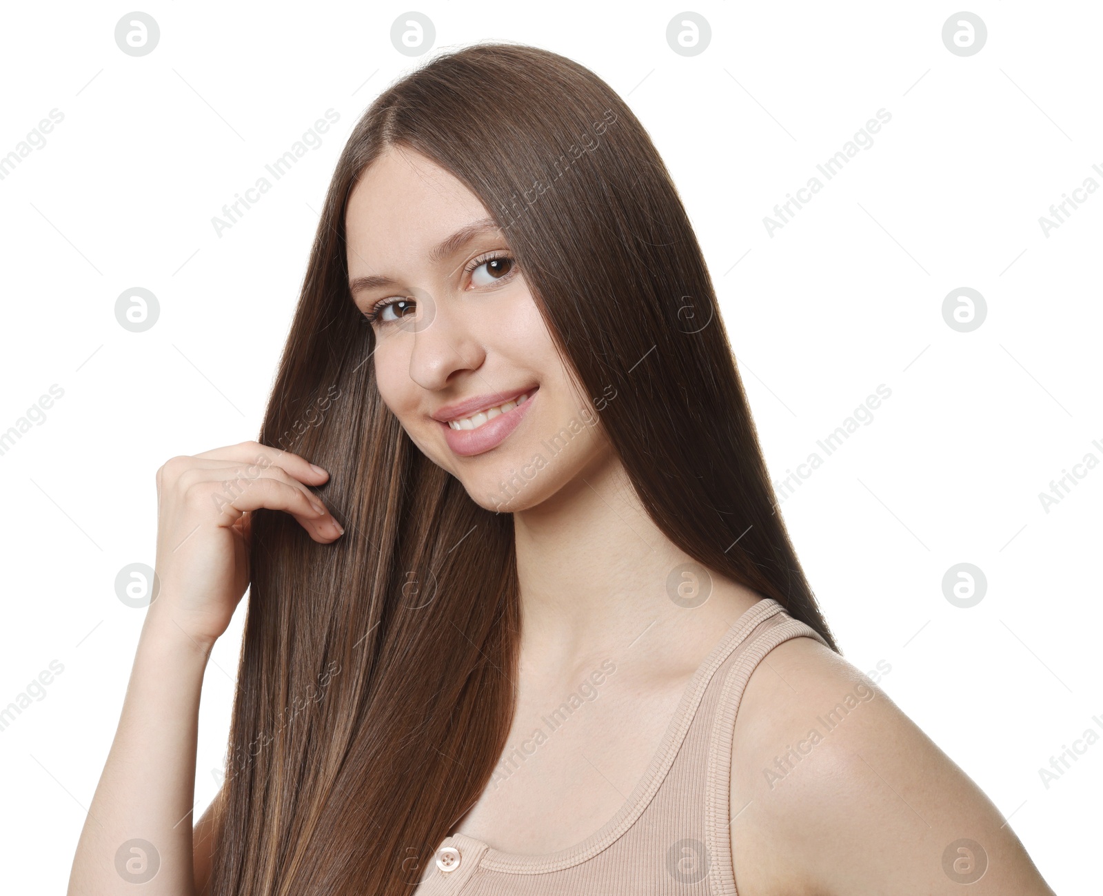 Portrait of smiling teenage girl with healthy long hair on white background Photo of Portrait of smiling teenage girl with healthy long hair on white background