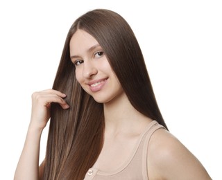 Photo of Portrait of smiling teenage girl with healthy long hair on white background