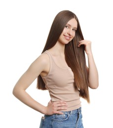 Photo of Portrait of smiling teenage girl with healthy long hair on white background