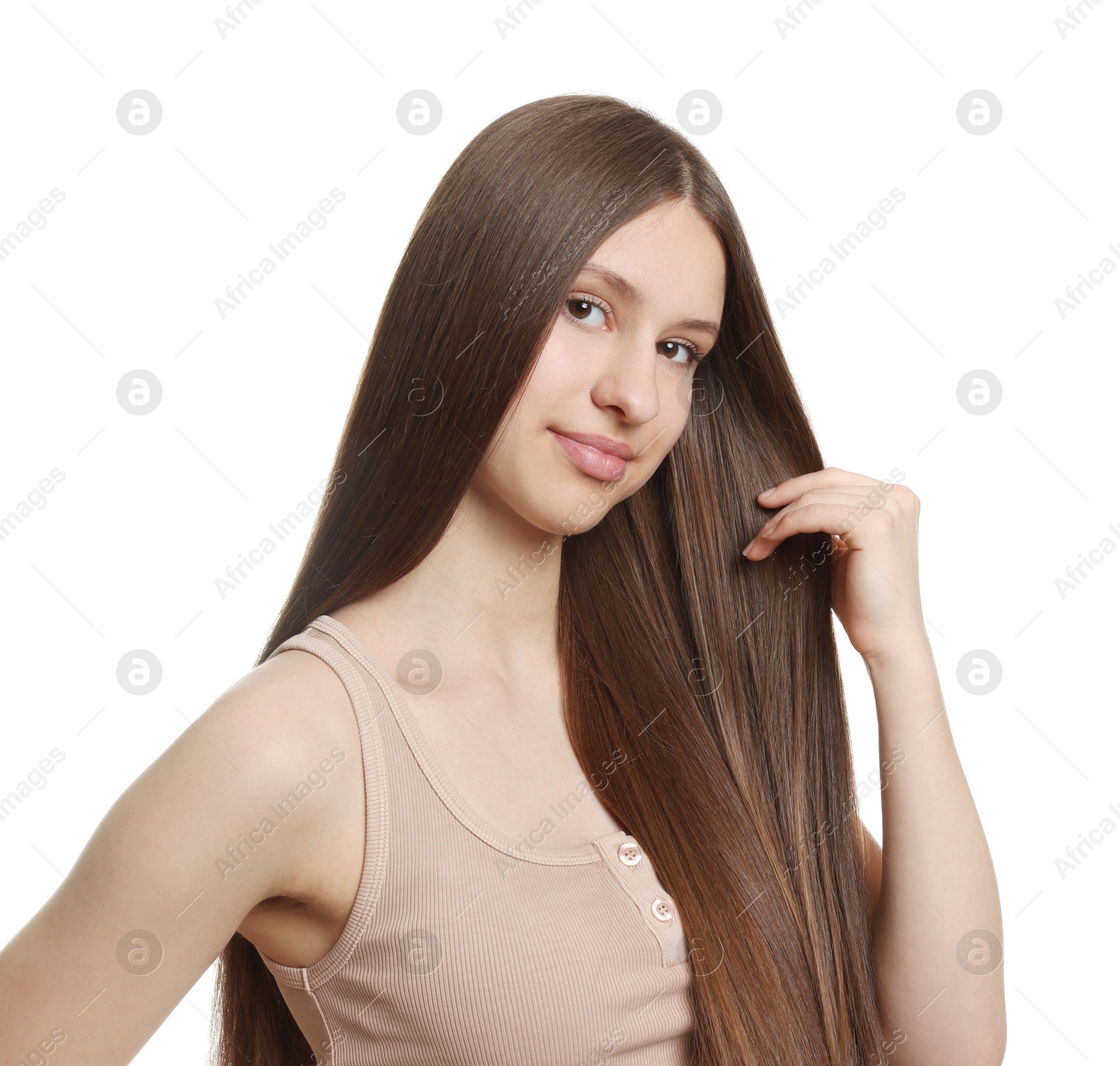 Portrait of beautiful teenage girl with healthy long hair on white background Photo of Portrait of beautiful teenage girl with healthy long hair on white background