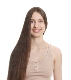 Photo of Portrait of smiling teenage girl with healthy long hair on white background