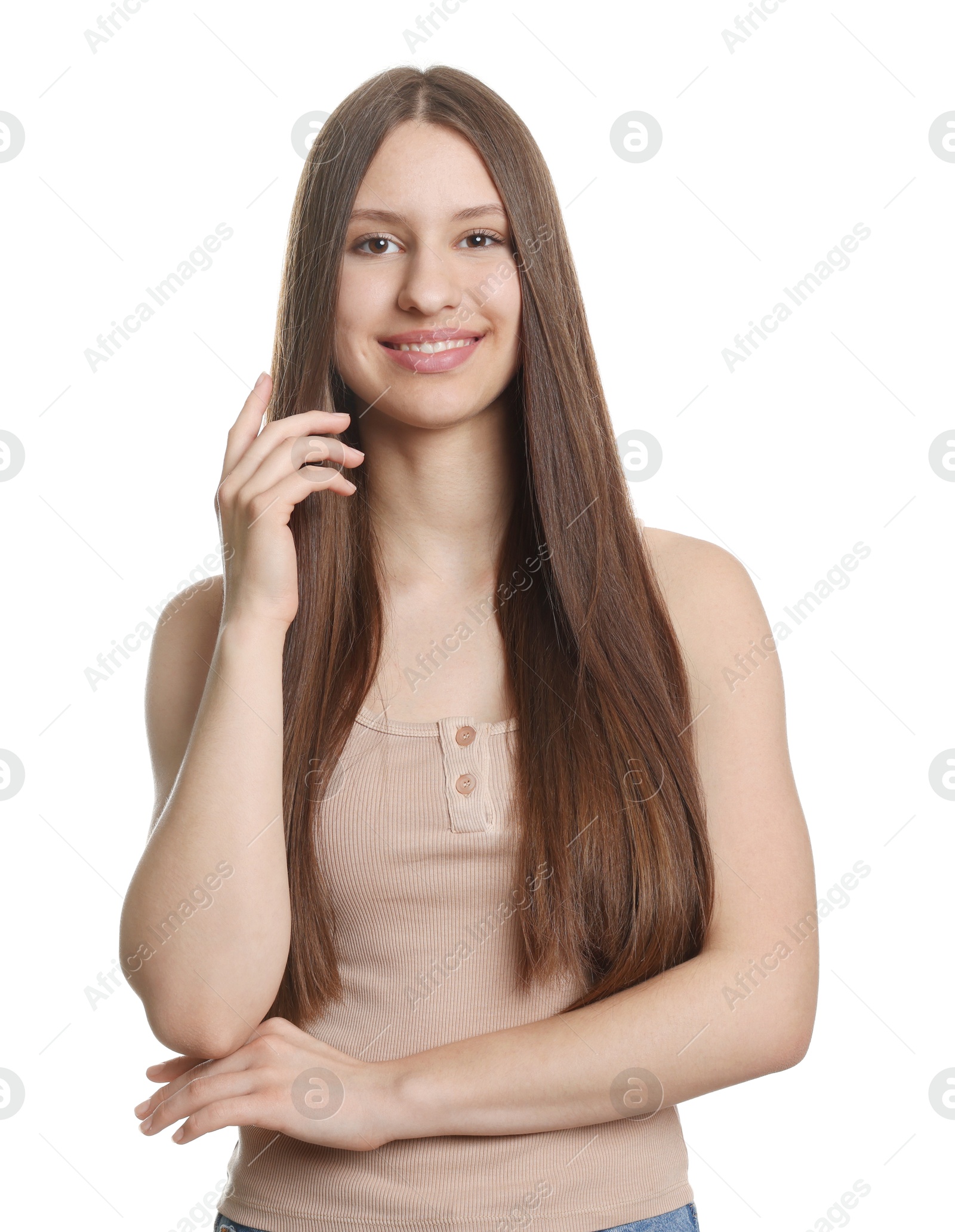Portrait of smiling teenage girl with healthy long hair on white background Photo of Portrait of smiling teenage girl with healthy long hair on white background