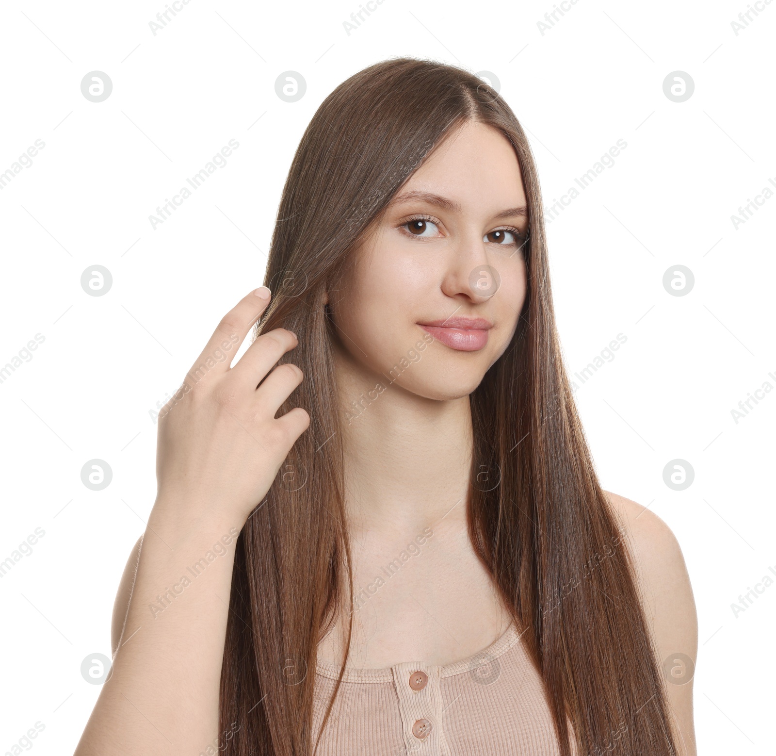 Portrait of beautiful teenage girl with healthy long hair on white background Photo of Portrait of beautiful teenage girl with healthy long hair on white background