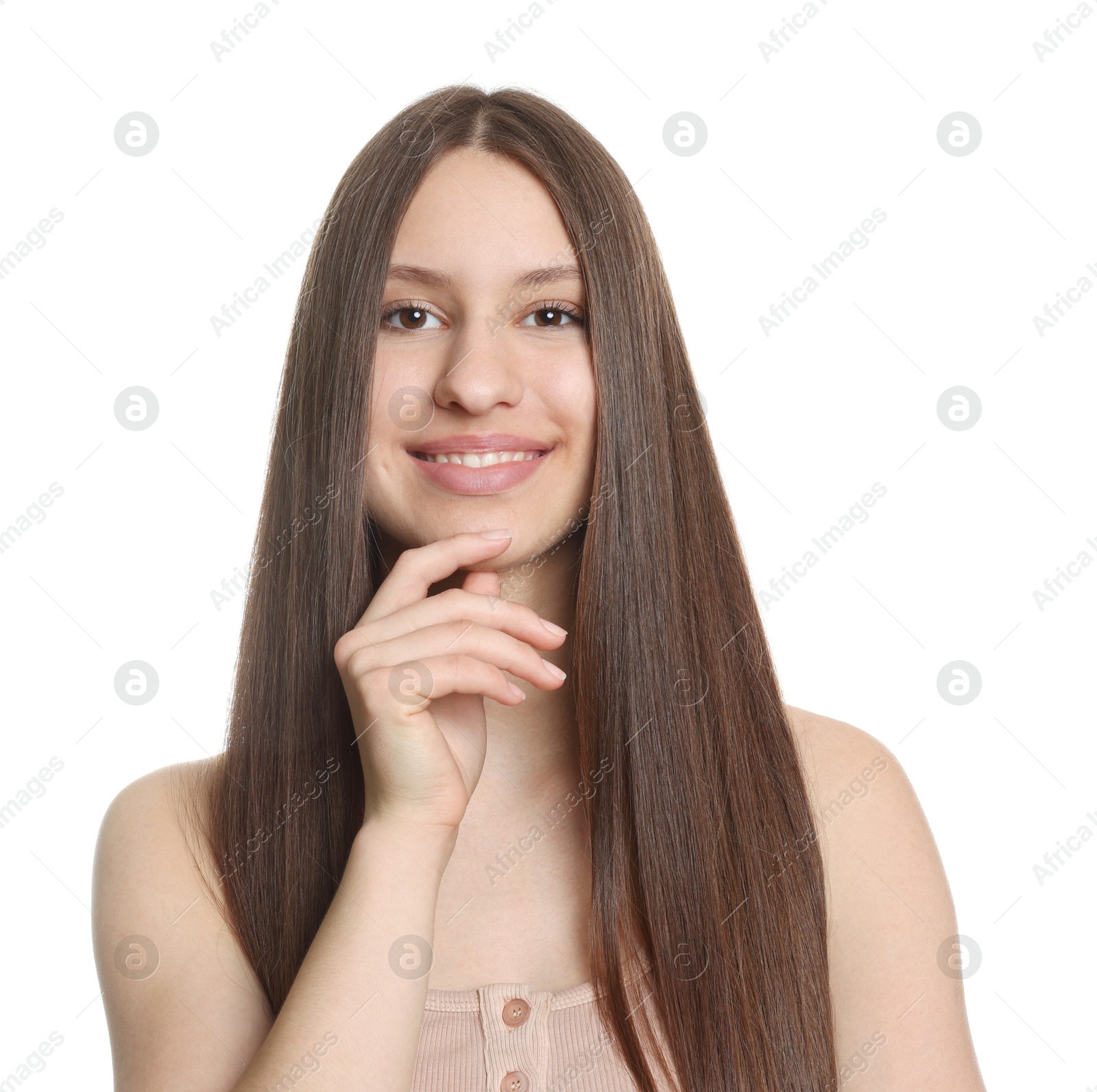 Portrait of smiling teenage girl with healthy long hair on white background Photo of Portrait of smiling teenage girl with healthy long hair on white background