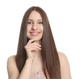 Photo of Portrait of smiling teenage girl with healthy long hair on white background