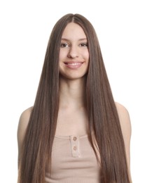 Photo of Portrait of smiling teenage girl with healthy long hair on white background