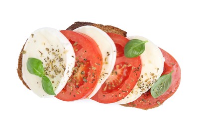 Photo of Tasty sandwich with mozzarella cheese, tomatoes, basil and spices isolated on white, top view