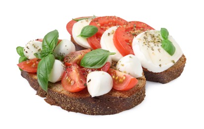 Photo of Tasty sandwiches with mozzarella cheese, tomatoes, basil and spices isolated on white